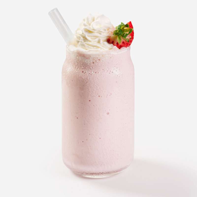 A delicious looking strawberry milkshake food product on a white background.