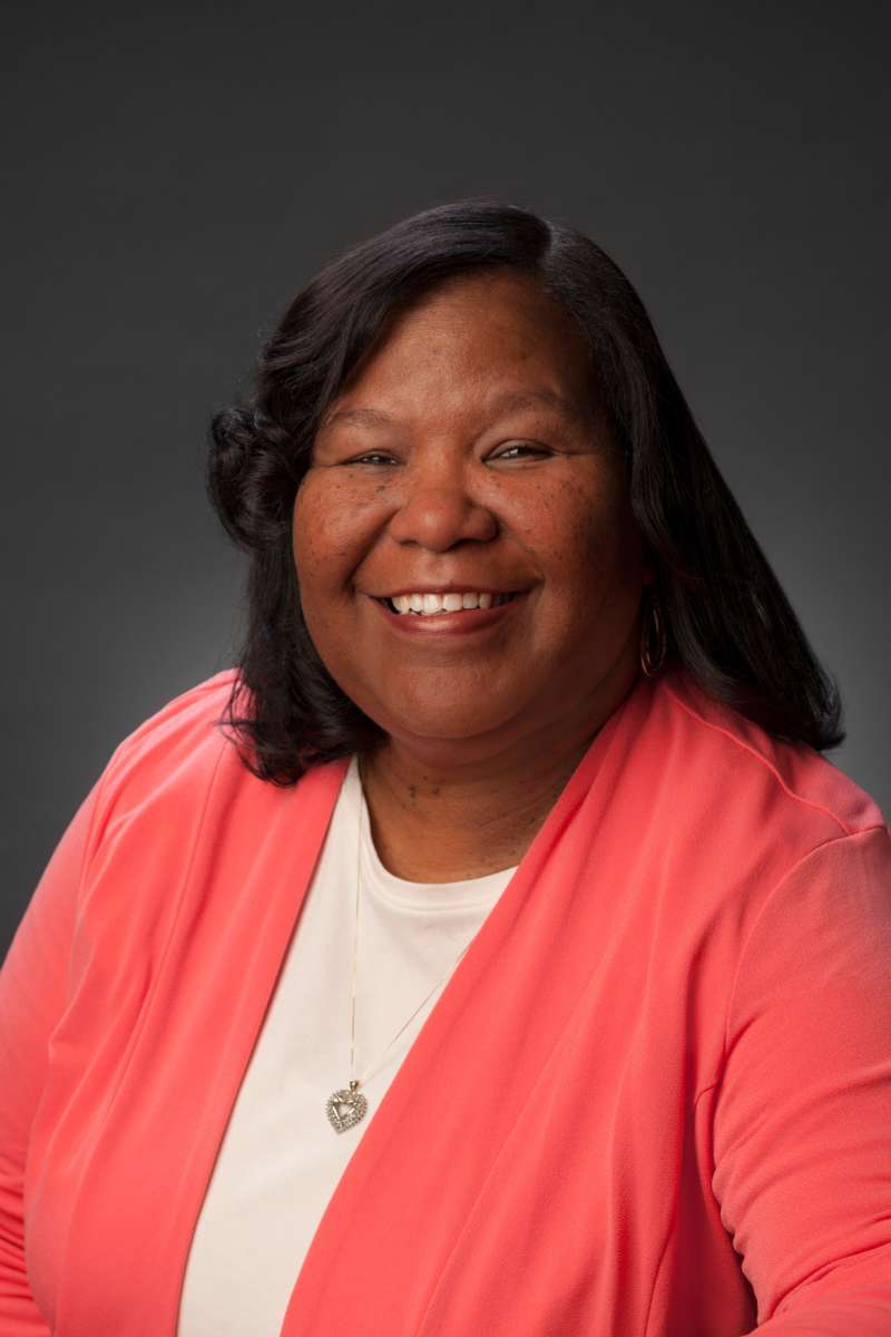 A headshot taken in Alabama showing an African American executive.