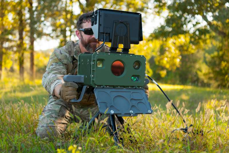 A defense lifestyle product photograph showing a man controling a defense product.